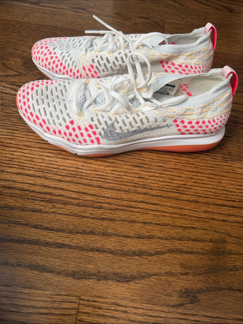 Nike Women's White Knit Running Shoes with Pink and Gray Accents
